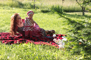 Wall Mural - mother and daughter at a picnic