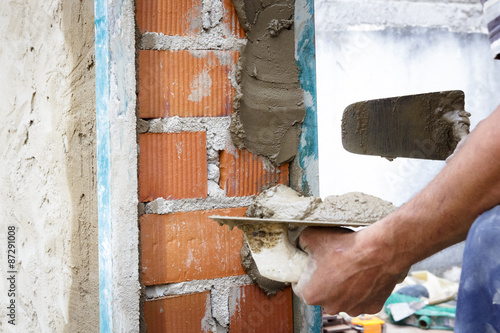 Fotografie, Obraz Obreros de la construcción trabajando en obra