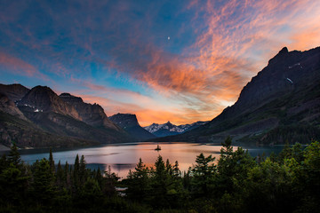 Beautiful colorful sunset over St. Mary Lake and wild goose isla