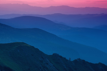 Canvas Print - Hills lines in mountain valley during sunset. Natural summer mountain landscape