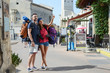 © W PRODUCTION - cheerful young couple backpacker traveling and sighseeing through europe during summer