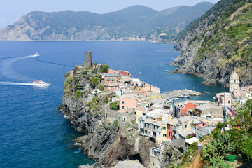 Wall Mural - Scenic view of colorful village Vernazza and ocean coast