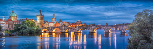 Naklejka dekoracyjna Prague at night Charles Bridge to the river and the old town center/The historic center of Prague, ancient architecture, and cultural heritage