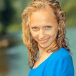 © ruslimonchyk - Portrait of a cheerful pleasant blonde girl with blue eyes and wet hair