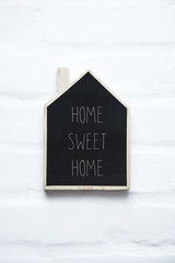 Wall Mural - House shaped wooden sign HOME SWEET HOME
