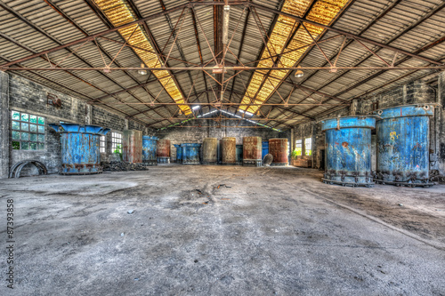 Obraz w ramie Concrete pipes moulds stored in an abandoned warehouse