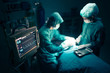 Surgeons team working with Monitoring of patient in surgical operating room. selective focus on Monitor.