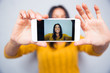 © Drobot Dean - Woman making selfie photo on smartphone