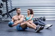 © WavebreakmediaMicro - Muscular couple doing abdominal ball exercise