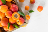 Fresh apricots on wooden table, close-up.