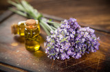 Fototapeta  - Wellness treatments with lavender flowers on wooden table. Spa still-life.