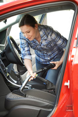 Wall Mural - Woman Cleaning Inside Of Car Using Vacuum Cleaner