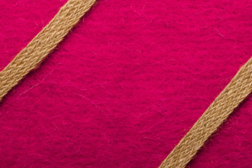 Wall Mural - Jute rope over pink background