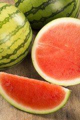 Wall Mural - slices of watermelon on wooden table