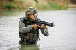 © kaninstudio - Portrait of a ranger in the battlefield with a gun