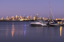 Boats Yachts City Skyline  At Sunset 