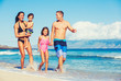 © EpicStockMedia - Happy Family Having Fun at the Beach