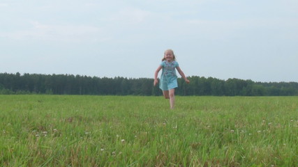 Wall Mural - beautiful little girl runs across the meadow