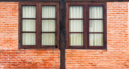 Wall Mural - round and vintage window on a brick wall building