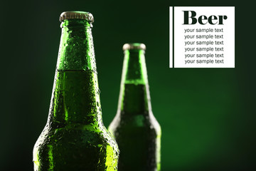 Poster - Bottles of beer on dark green background