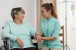 Professional carer nursing elderly lady
