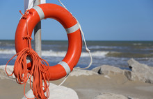 Orange Jackets With Rope To Rescue Swimmers In The Sea In Summer