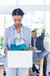 © WavebreakmediaMicro - A fired businesswoman holding box