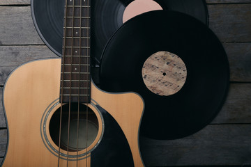 Wall Mural - Guitar and vinyl records on wooden table close up