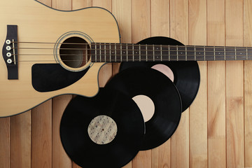 Wall Mural - Guitar and vinyl records on wooden table close up