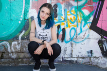 Young Beautiful Girl Agains Graffiti Wall