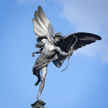 Statue Of Eros, Piccadilly Circus, London. A Low Angle View Of The Familiar Statue Of Eros In Piccadilly Circus, London.
