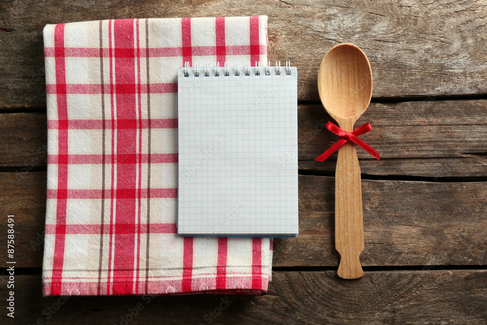 Open recipe book on wooden background