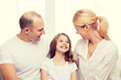 © Syda Productions - smiling parents and little girl at home