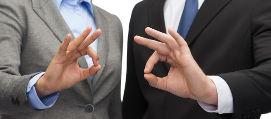 Wall Mural - businessman and businesswoman showing ok sign