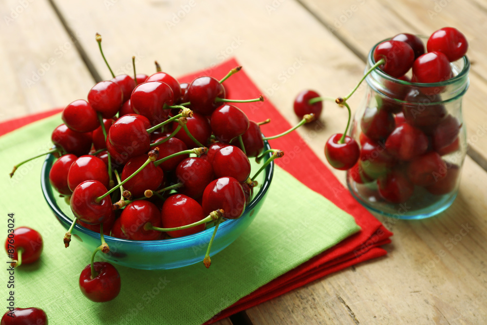 Sweet cherries in bowl on table close up