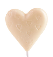 Wall Mural - Chocolate heart shaped candy on stick isolated on white