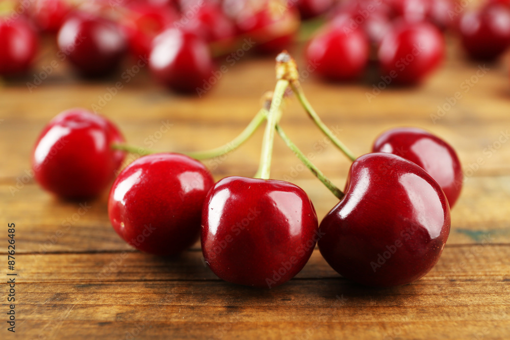 Fresh cherries on wooden table, closeup