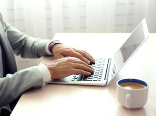 Man working with laptop in office