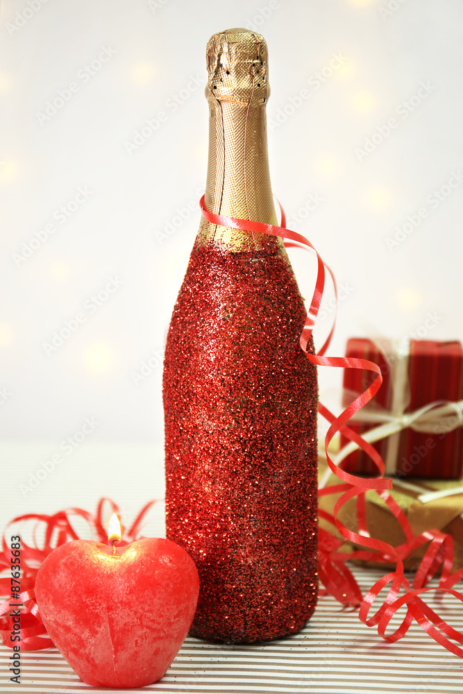 Decorative champagne bottle on light background