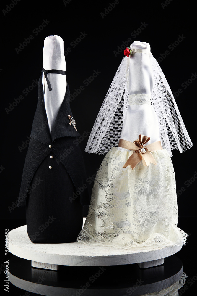Wedding decoration of champagne bottles on black background