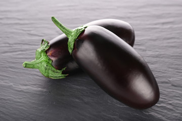 Fresh eggplant on wooden background