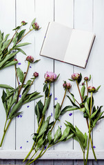 Wall Mural - Peonies flowers with sketchbook. Mock up.  Hipster interior room