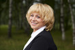 © Andrey_Arkusha - Portrait of serene mature woman in the summer park
