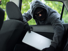 Car Theft - A Laptop Being Stolen Through The Window Of An