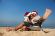 © kraevski - Christmas couple on a beach