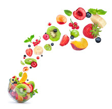 Fruit Salad Ingredients In The Air In A Glass Bowl Isolated On W