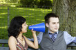 © DW labs Incorporated - Man ignoring woman with megaphone.