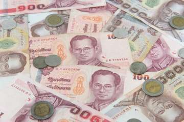 Random Thai Baht coins and banknotes as background