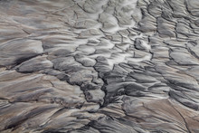 Abstract Patterns Made By Water Flowing Over A Volcanic Valley In The Interior Of Iceland.