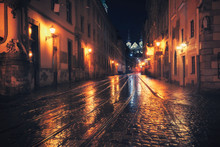 Retro Style Photo Of Old European City At Night